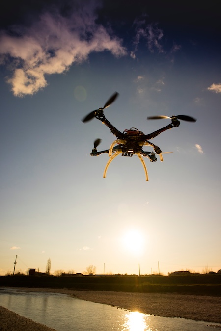 Drone flying above a river at sunrise for aerial video production