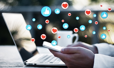 Laptop and smartphone representing social media management and online brand communication