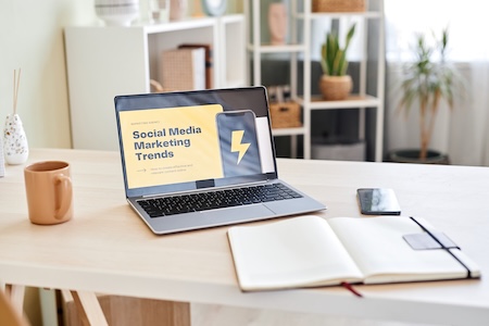 Social media advertising analytics and campaign performance on a laptop